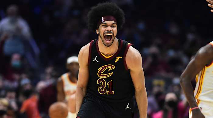 Cavaliers center Jarrett Allen yells to celebrate a dunk.